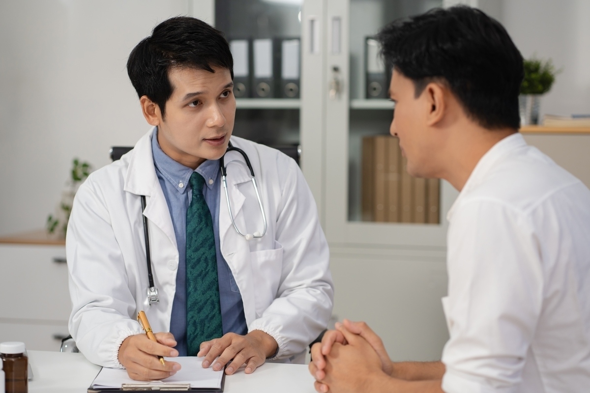 Male patient in consultation with doctor discussing what to expect from TRT progress